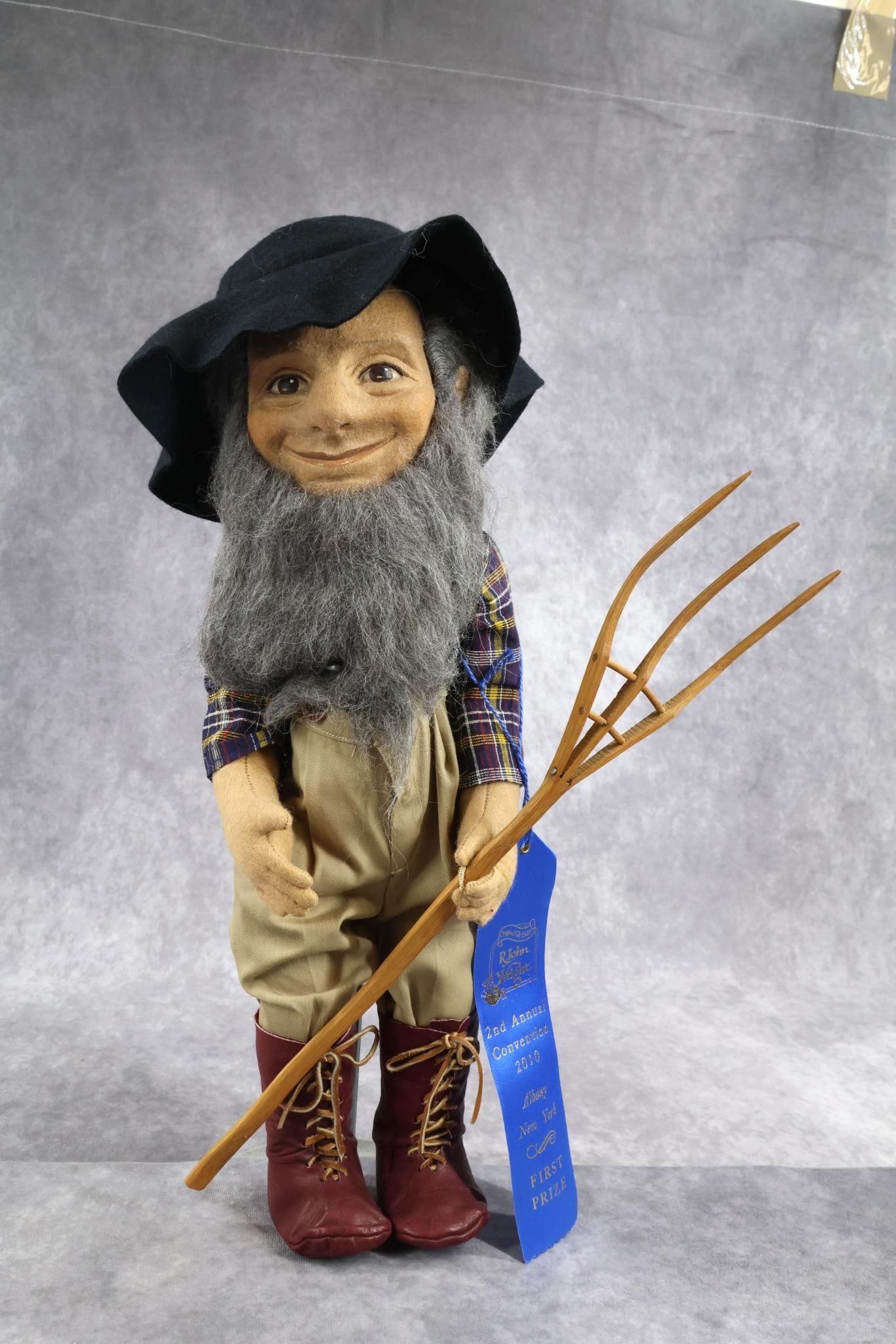 R. JOHN WRIGHT.: 17" 1977-1978 R. John Wright "Giuseppi" Doll. He has a receding hairline, with steel gray beard, hair. Clothing is reminiscent of an Amish Farmer. Made in (3) versions, he is wearing a black felt hat