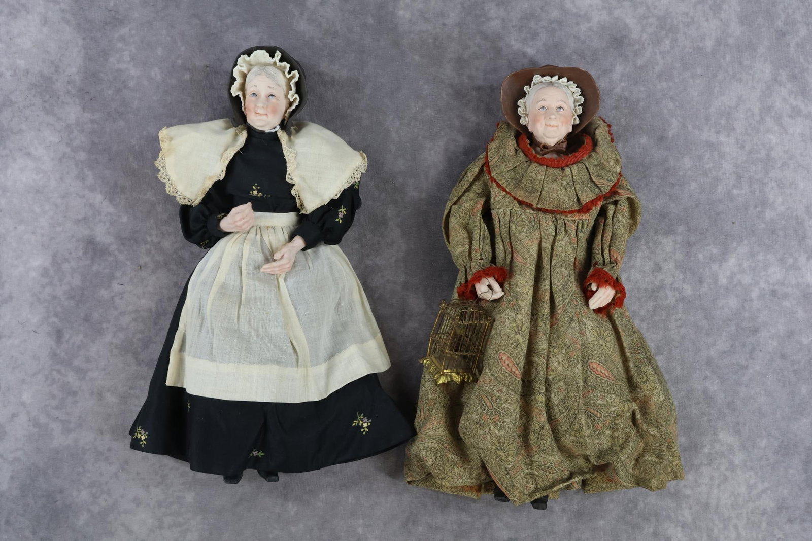 ARTIST DOLL(S), MARTHA THOMPSON.: Pair of character dolls by NIADA artist Martha Thompson ( 19??-1964). 11" Elderly Woman with bisque character face. Molded black hat with porcelain lace around trim. 11" Elderly Woman with bisque char