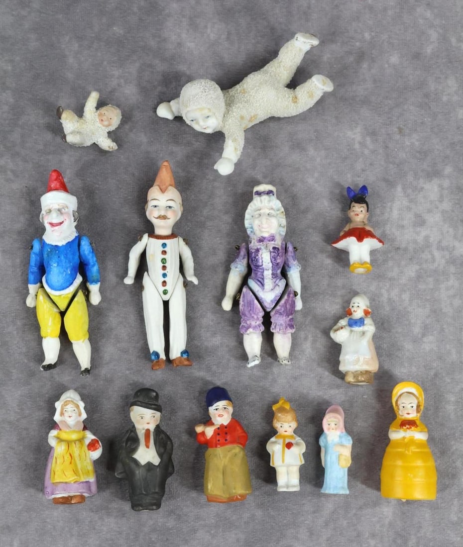 GERMAN ALL BISQUE DOLL(S).: LOT of (13) dolls. (2) Snowbabies - (1" Japan). (3) Wire strung Clowns/Jesters 3 3/4"-4". (1-Has a chipped foot.) (8) Immobiles (the Dutch china and the man are Japan). Condition: as stated. Some pain