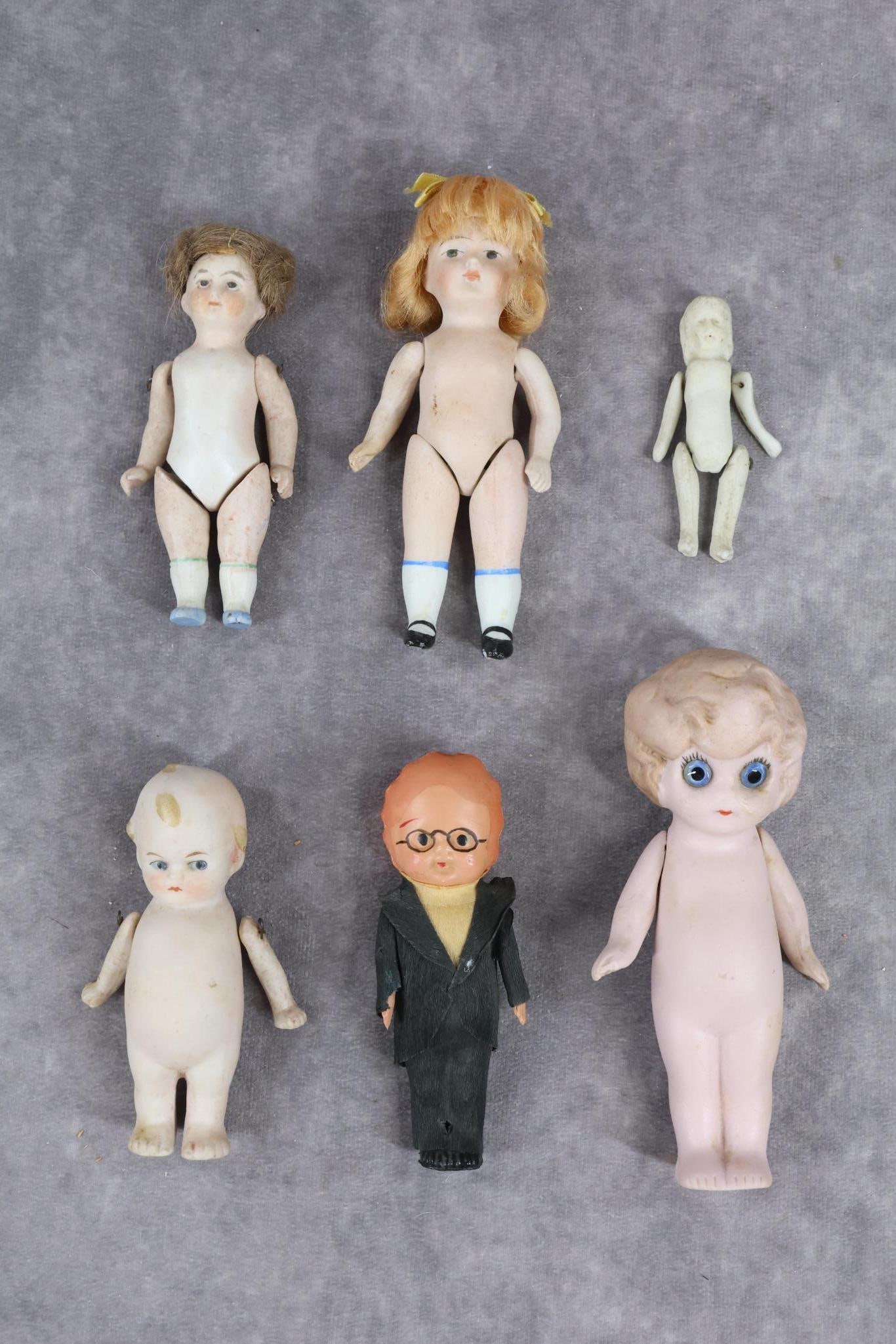 ALL BISQUE DOLLS/OTHER.: LOT of (6) dolls. German all bisque - 5" Pink Betty Boop type with blue glass eyes. Strung arms. 4 3/4" 252 11 SWC doll with painted features/shoes, strawberry blonde mohair wig, 5 pc. body. 4" 5000 D