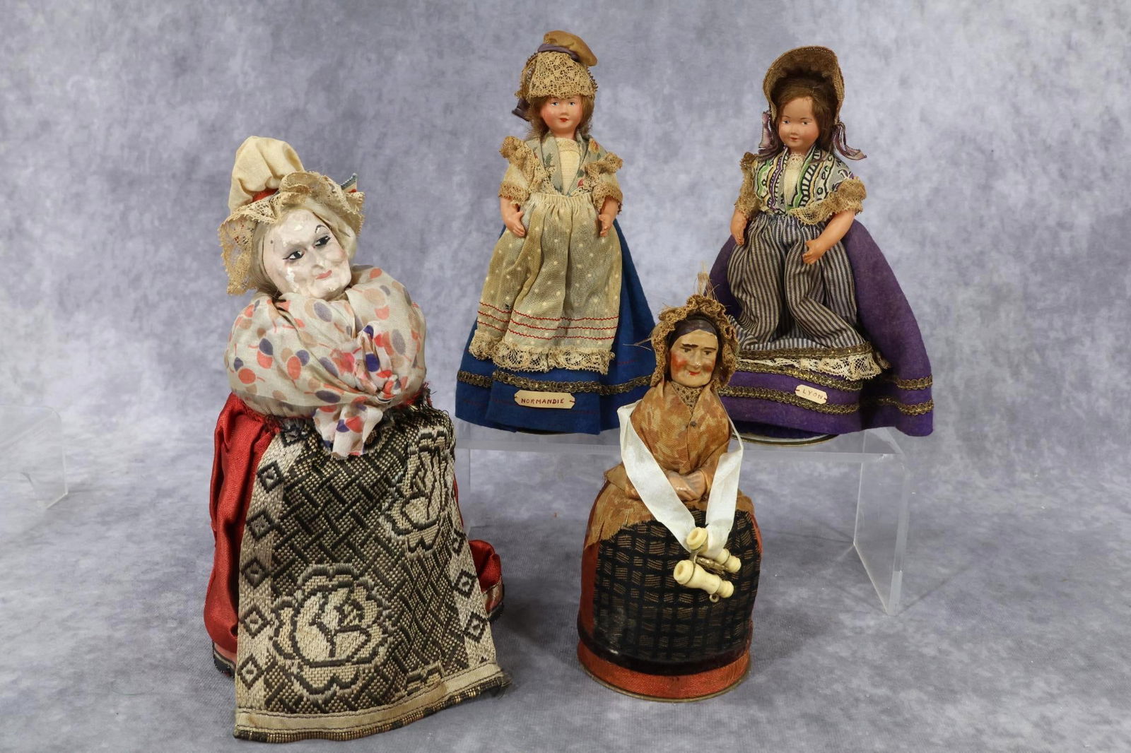 NOVELTIES/HOLIDAY.: NOVELTY - LOT of (4) antique Candy Containers in the form of Women. 7" Elderly Lady with chalk head. (bottom base of container is missing). 6" Elderly Lady with papier mache head with a stanhope aroun