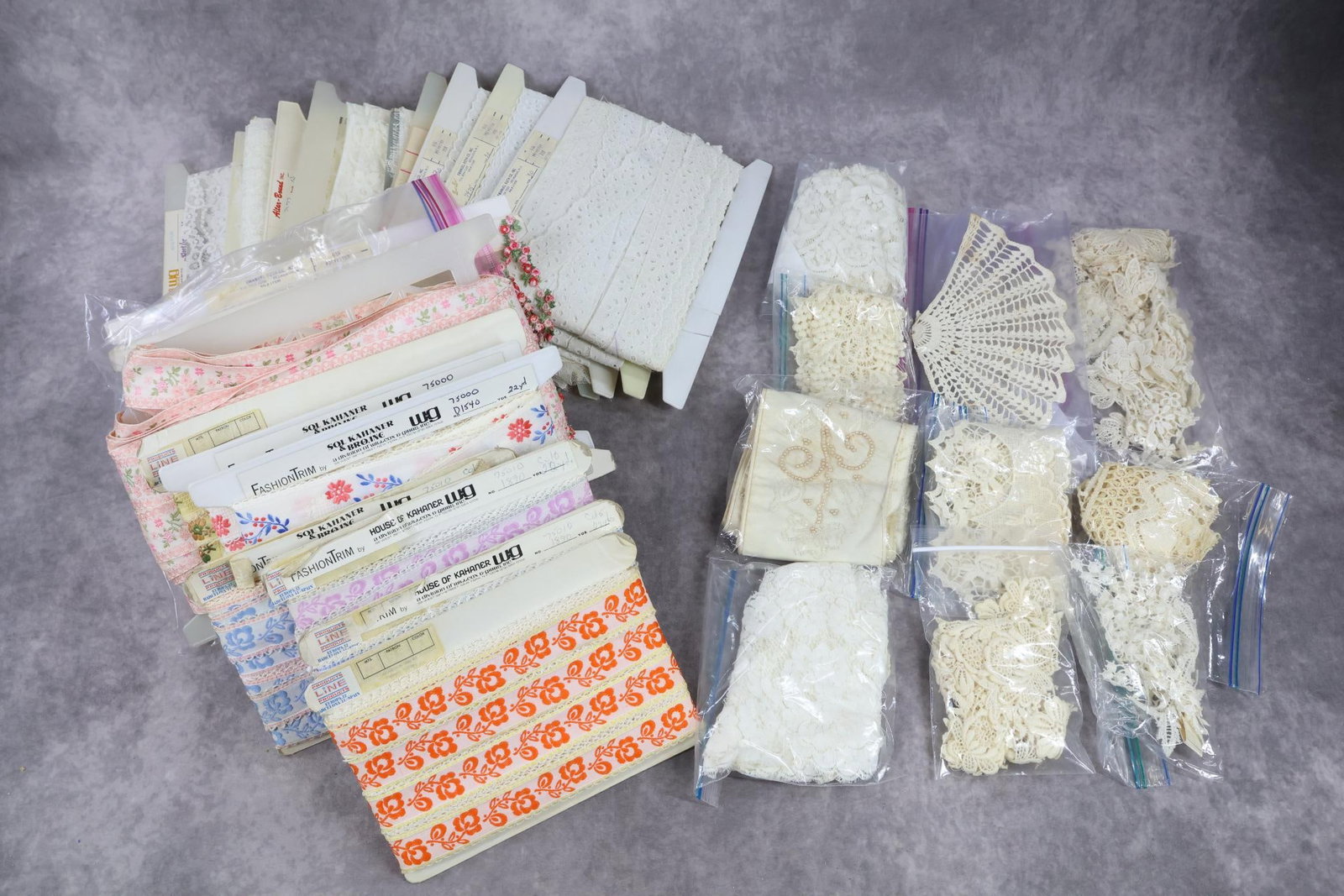 VINTAGE LACES TRIMS.: LOT. This lot of carded laces and trims came out of a well known New York Bridal Shop that did custom dressmaking. (7) Cards of lace 3" - 11" W. (4) Cards of cotton eyelet 1" - 1/4" W. (8) Cards of wo