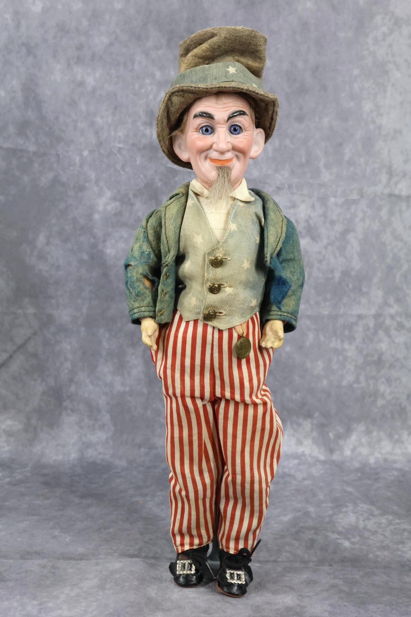 ANTIQUE BISQUE HEAD CHARACTER DOLLS.: 13" "Uncle Sam" Portrait Doll Marked S 1 GERMANY. (COD). Stationary blue eyes, grey human hair wig and beard. Papier mache jointed body. Dressed in what appears to be all original felt and cotton anti