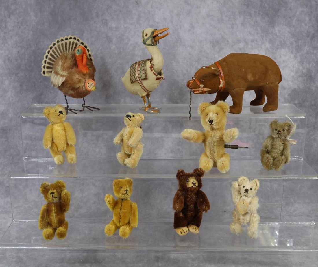 TOYS, VINTAGE STEIFF.: LOT. 4" T. German papier mache Bear with amber glass eyes. 5" T. German? papier mache nodding Duck with amber glass eyes, metal feet. Mouth opens and closes when head is nodding. (Paint loss on fet, a