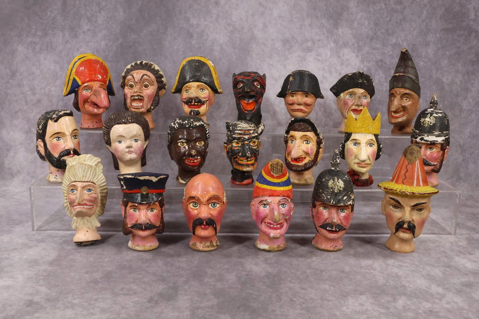 TOYS.: LOT. Antique parts for PUNCH and JUDY puppets. (20) Character Heads made from papier mache, carved wood. Condition: age loss, paint loss. Horns missing from (1) Devil. (19) Sets of hands, (1) papier m