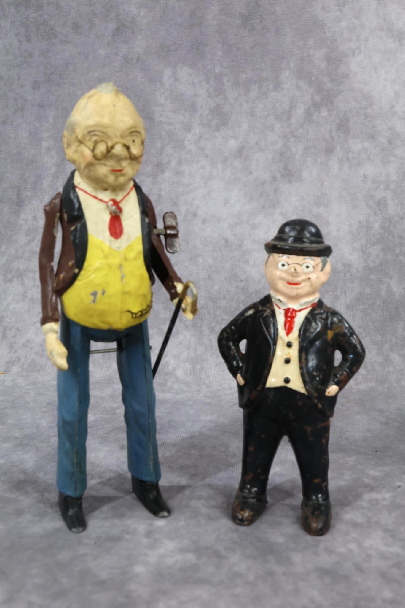 TOYS.: Pair of "Foxy Grandpa" items. 7 1/2" German wind-up toy. Ca. 1910. He has weighted feet and when wound, he moves around and right arm moves. Condition: paint loss. In working order. 5 1/2" Unmarked ca