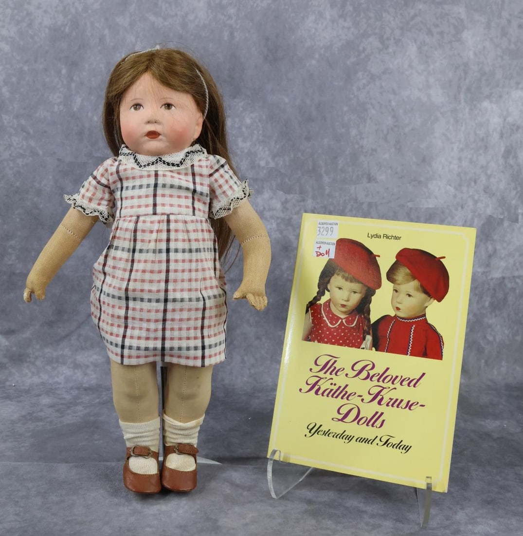 KATHE KRUSE.: LOT. 14" Doll VII? with painted muslin head, brown human hair wig. 3-Vertical leg seams on back. Does not have sewn on thumbs. Legs with disc joints. Dressed in vintage clothing, red leather shoes. Co