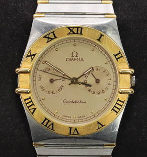 Omega Constellation Wristwatch: Stainless Steel, 33mm round case with Roman numeral bezel and inner gold dot hour markers, day and date registers. Quartz movement.