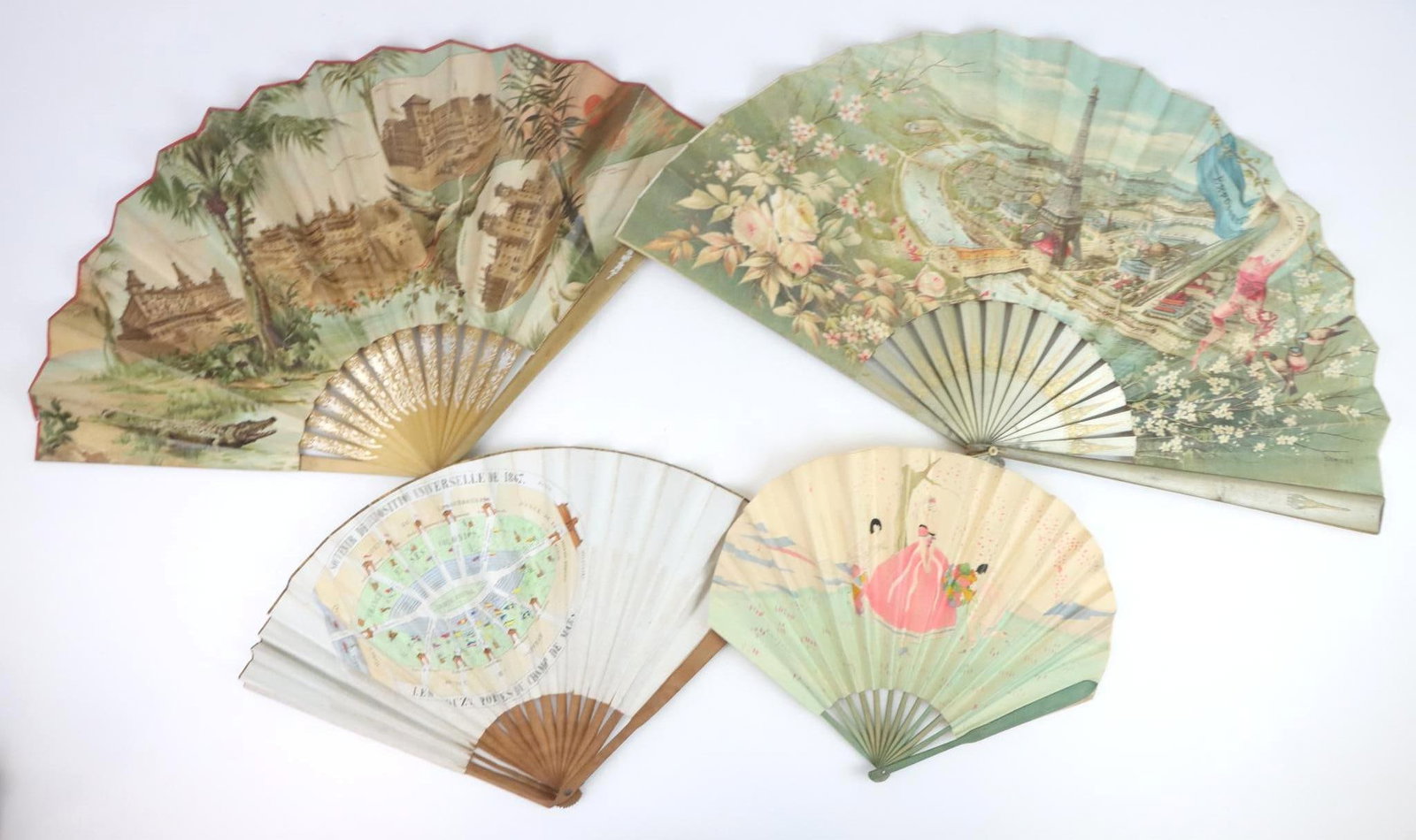 World Exposition & Henry Flagler Souvenir Fans: World Exposition folding fan, Paris, c. 1889, hand tinted Parisian scene, wood ribs, marked. Art Deco folding fan, printed signature of Robert Polack, France, paper and wood ribs. World Exposition fol