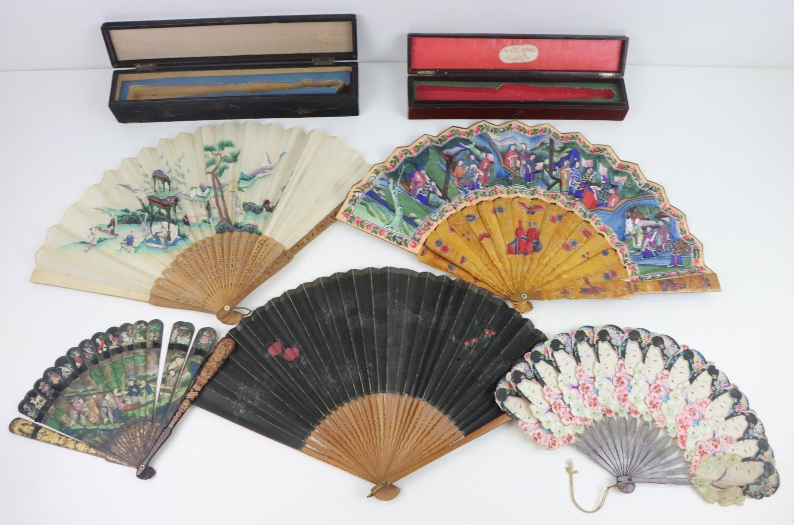 Asian Folding Fans: Folding fan, hand painted die-cut portraits with lacquered wood ribbing. Asian folding fan, carved and pierced wood handle and ribs, hand painted fabric. Asian folding fan, lacquered wood handle and r