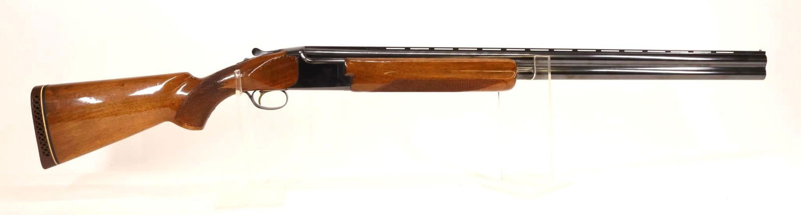 Browning (Japan) Citori Over Under Shotgun: 12Ga. 28" bbls, 3" chambers, Imp/Full chokes, SN 29477H57. 95% blue finish shows thinning on crisp edges with a few scattered freckles and a small nick in left side of vent rib 1" behind bead and a sm
