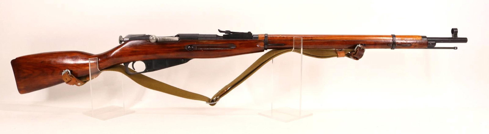 Soviet Izhevsk/R Guns M91/30 Mosin Nagant Bolt Action Rifle: 7.62x54R, 29" bbl, SN R10876. 98% black paint finish shows thinning on crisp edges, fair bore, top of breech marked with triangle and arrow, hammer and sickle wreath and dated 1941, wood stock and han