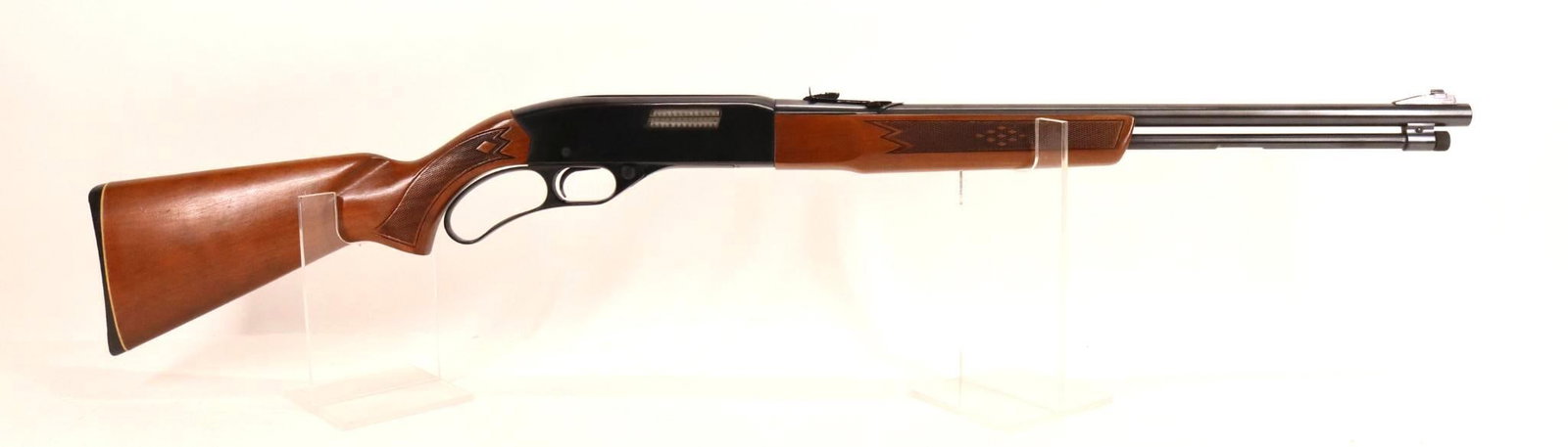 Winchester Model 250 Lever Action Rifle: 22S,L,LR, 20" bbl, SN B946591. 98% blue finish shows only a few faint scratches, good bore, checkered wood stock and forearm show light handling with a few small nicks and shallow dents. 13 5/8" LOP, 