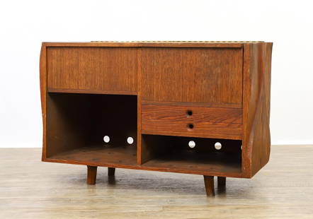 Manner of Wendell Castle Stereo Cabinet: Shaped oak media / stereo cabinet with two lift top compartments over two small drawers with open sides and an open compartment. Included are freeform leg extensions which need new dowels. 28.75"h x 4
