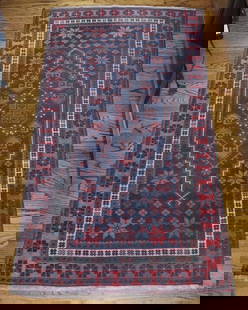 Persian Area Rug: Handwoven wool, geometric flowers. 73” x 38.5”. Kitchen