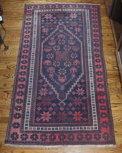 Persian Area Rug: Handwoven wool, geometric flowers. 73” x 38.5”. Kitchen