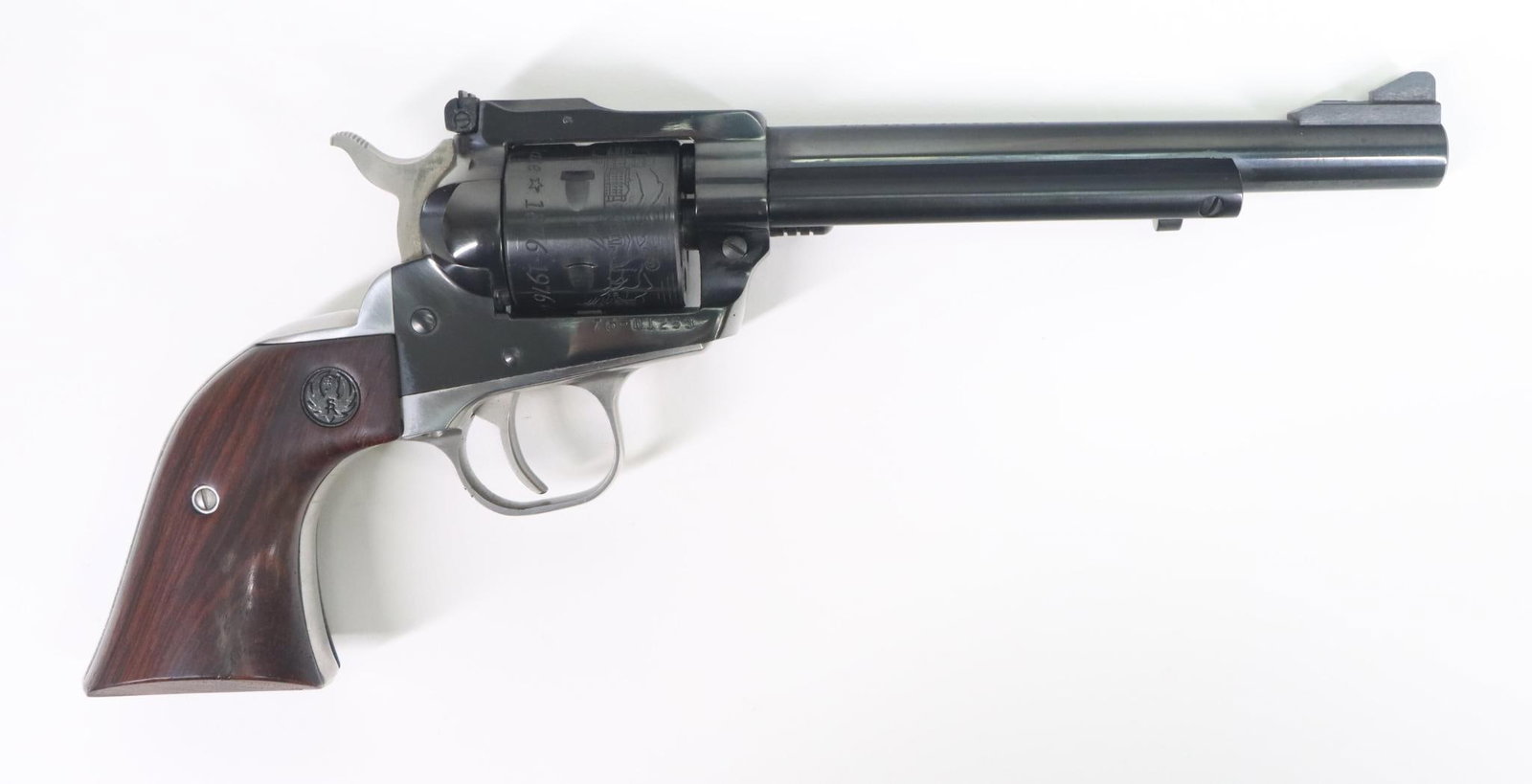 Cased Ruger New Model Single Six Combo Colorado Centennial Commemorative Single Action Revolver: 22LR with additional 22 WMR cylinder, 6 1/2" bbl, SN 76-01253. 100% blue finish,good bore, barrel engraved on left side 1876 Colorado Centennial US Bicentennial 1776. Nickel trigger guard and back str