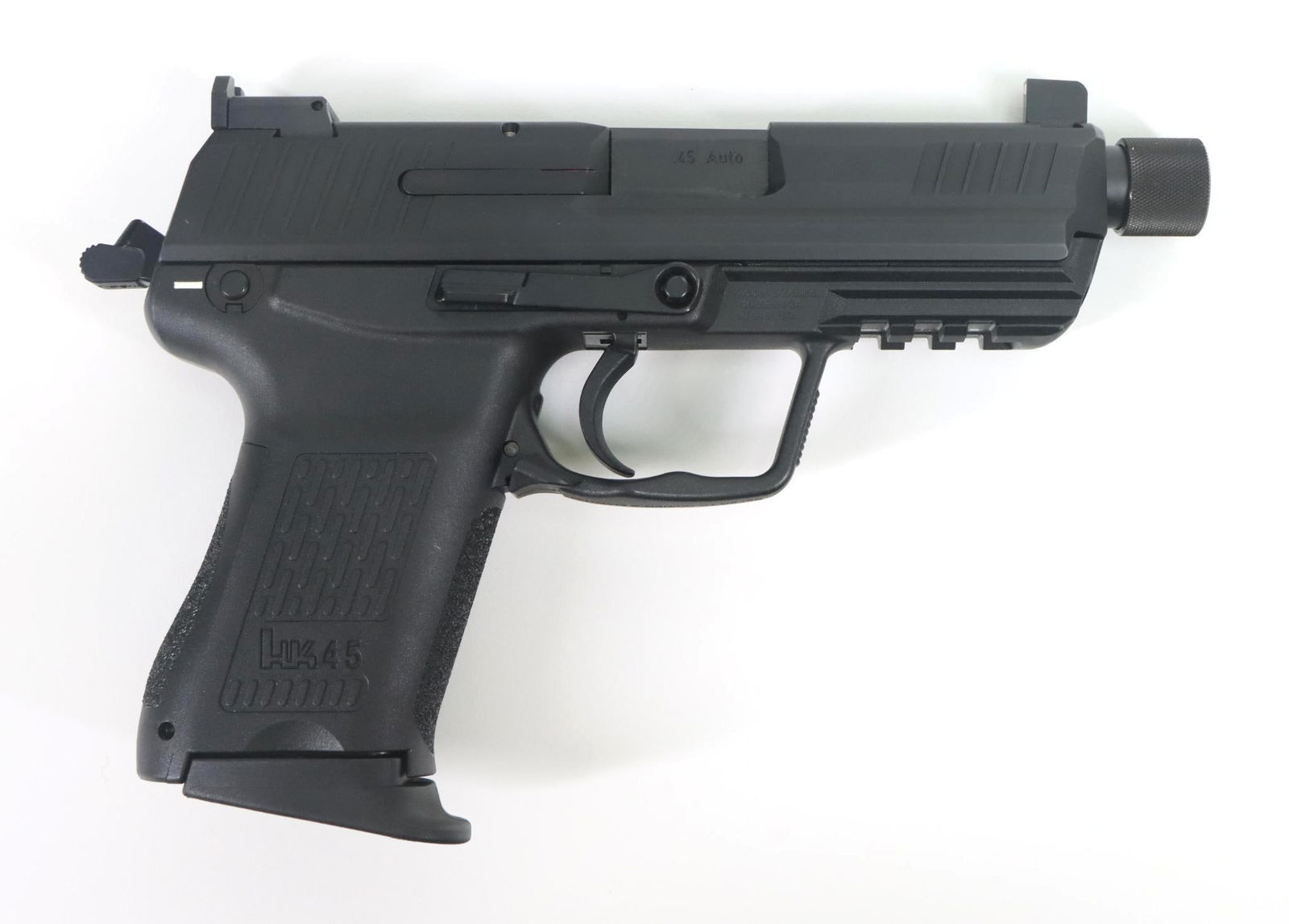 Heckler & Koch 45C Semi Automatic Pistol: 45 Auto, 4 5/8" bbl, SN 216-026952. 99% matte black finish on slide shows only very light handling, good bore, threaded muzzle, polymer frame/grip shows no handling, 1-8 rnd magazine, extra palm swell
