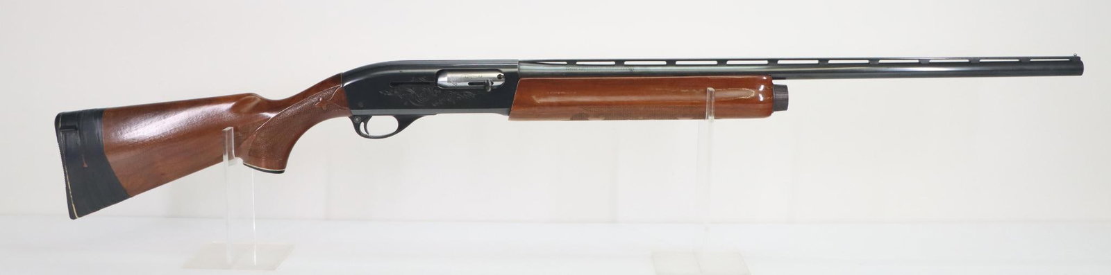Remington 1100 Semi Automatic Shotgun: 20Ga, 25 1/2" bbl, 2 3/4" chamber, IMP choke, SN L491300X. 98% blue finish shows thinning on carry points and crisp edges with a few scattered freckles, good bore shows a small area of scratches near 