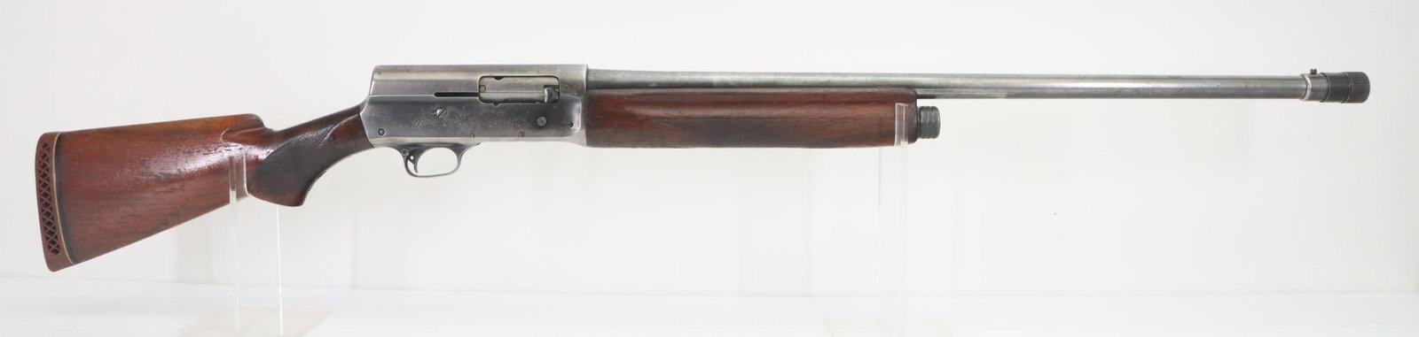 Remington Model 11 Semi Automatic Shotgun: 12Ga, 28" bbl, 2 3/4" chamber, adjustable Poly choke, SN 406109. 50% thin blue finish shows mostly gray/silver patina, good bore, checkered wood stock and forearm show heavy handling with denting and 