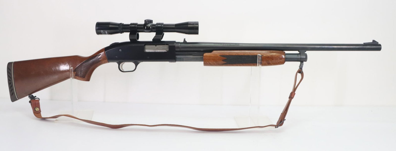 Mossberg 500A Pump Action Shotgun: 12Ga, 24" Slugster bbl, 3" chamber, cyl bore choke, SN K308886. 99% blue finish shows only very light handling, good bore (smooth) rifle sights, Swift 4x scope with duplex reticle and clear optics mou