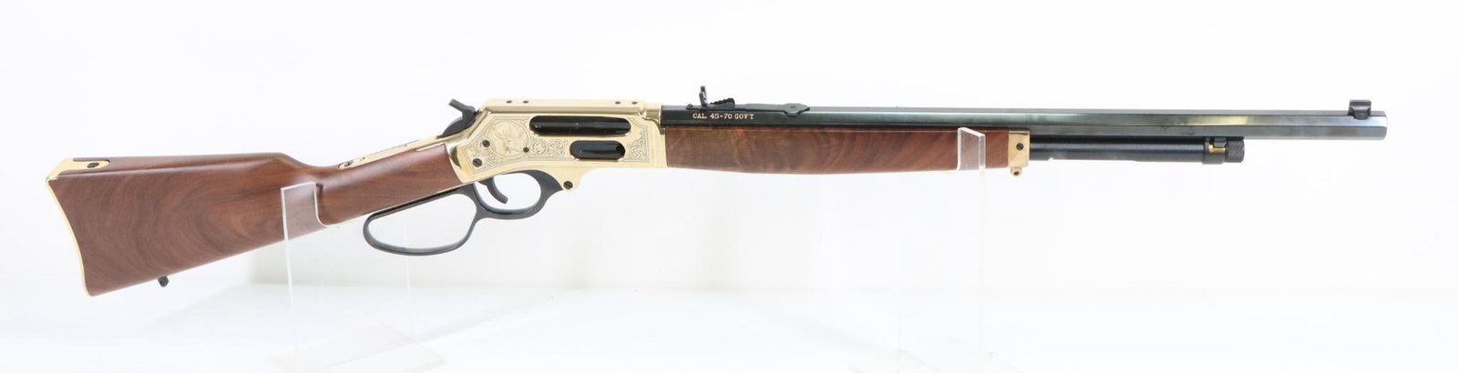 Henry HO10BGWL Lever Action Rifle: 45-70, 22" octagon bbl SN FFSBWL0138G. 100% blue finish on barrel, good bore, brass finish engraved receiver with big game animals shows only very light handling, adjustable buckhorn rear sight, highl