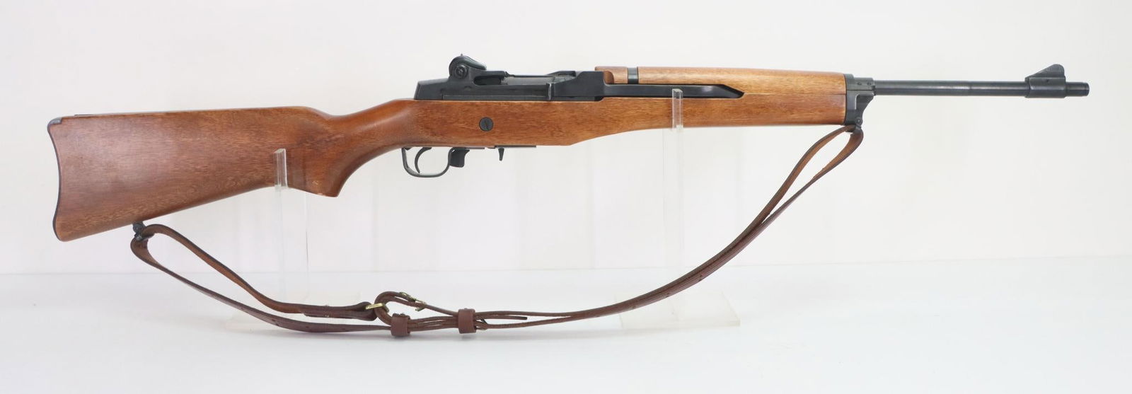 Ruger Mini 14 Semi Automatic Rifle: 223 Rem, 18 1/2" bbl, SN 180-29102. 99% blue finish shows only very light handling, good bore, wood stock and handguard show a few shallow dents and minor chips on pistol grip with small area of white