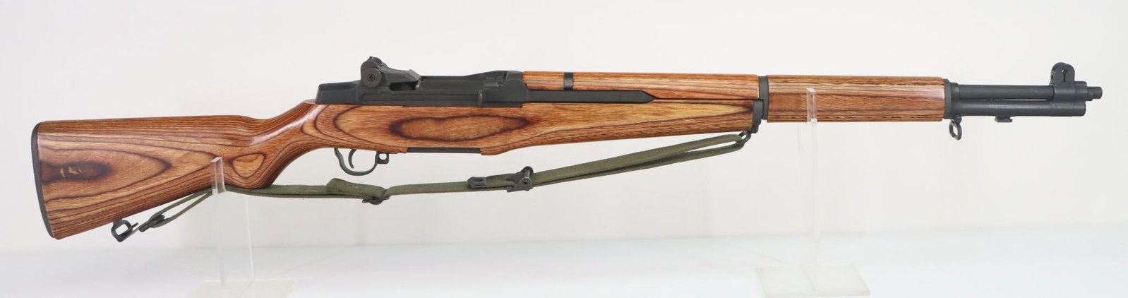 Springfield M1 Garand Semi Automatic Rifle: 30-06, 24" bbl, SN 1708507. 98% gray /green parkerized finish shows light handling, good bore, ME gauge reads .3025. breech marked SA-1-51, replacement laminated wood stock shows light handling with a