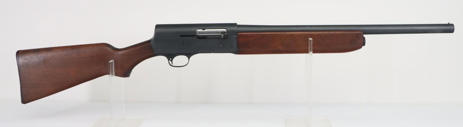 Remington Model 11 Trench Gun Semi Automatic Shotgun: 12Ga. 20" bbl, Cyl bore choke, SN 493525. 98% low luster (Military Finish) shows thinning on crisp edges, good bore, left side of receiver marked with US and flaming bomb, wood stock and forearm show 