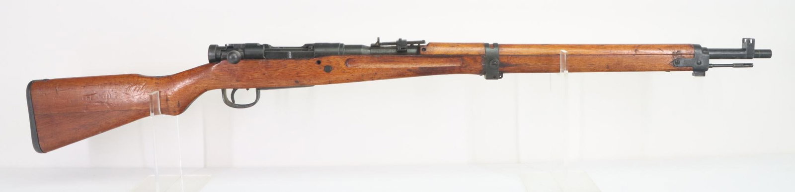 Japanese Nagoya Type 99 Arisaka Short Rifle Bolt Action Rifle: 7.7 Jap, 25 5/8" bbl, SN 20373. 95% blue finish shows average handling, good bore, guarded front sight, flip up rear ladder missing anti aircraft wings, ground mum, wood stock shows average handling. 