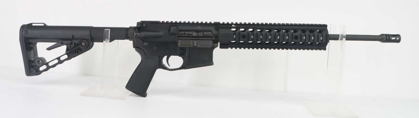 Colt M4 Carbine Semi Automatic Rifle: 5.56, 17 1/2" bbl including flash hider, SN LE178202. 99% matte black finish shows light handling, good bore, quad rail ventilated forearm/handguard with full length top rail, flash hider, MAGPUL text