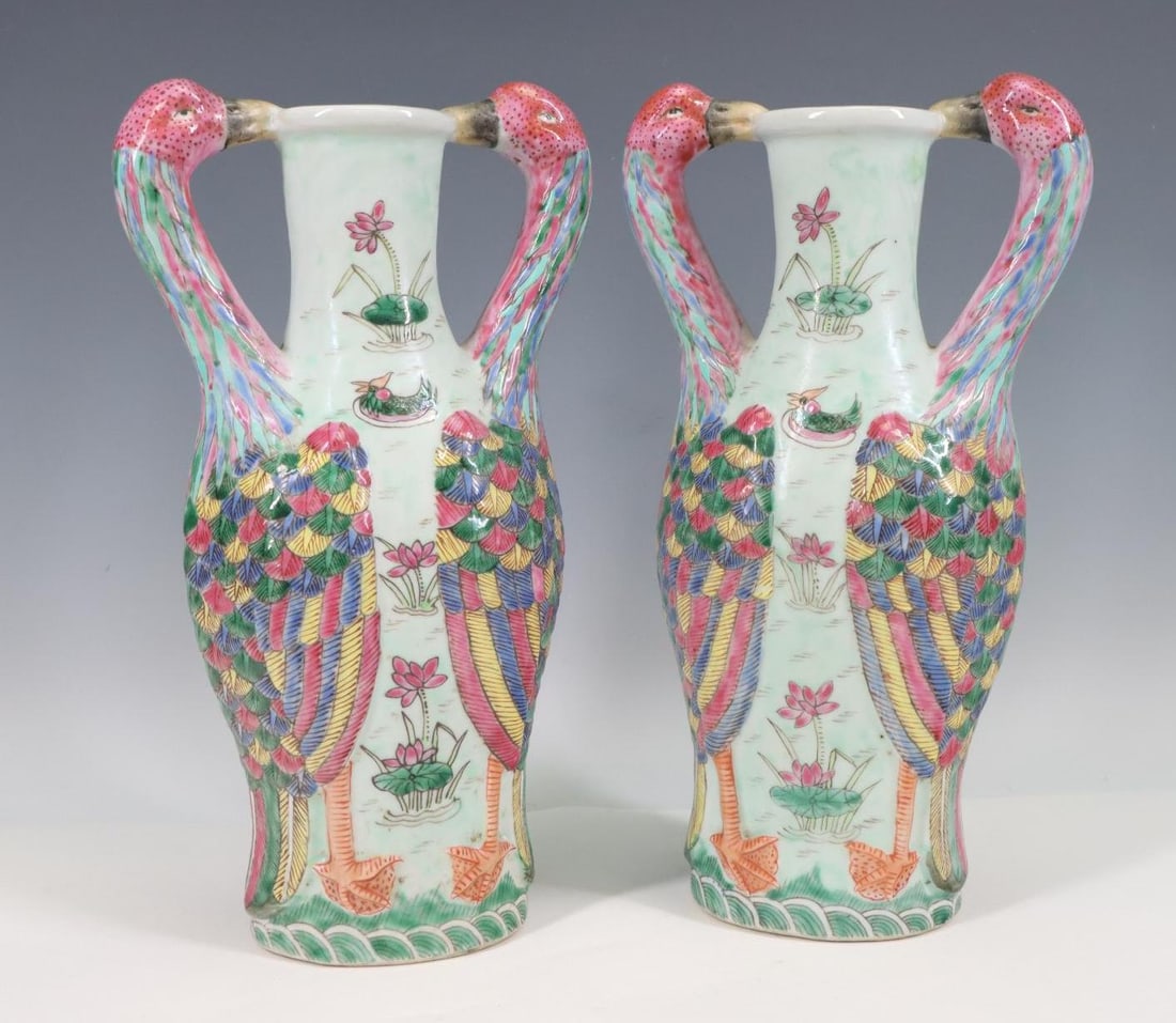 Chinese Famille Rose Vases: Qing era, pair of Chinese famille rose vases decorated with crane handles, frieze of water and lotus flowers. Base unmarked. 10.5"h