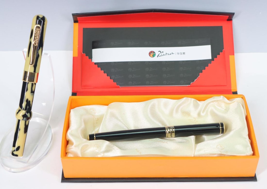 Picasso, Conklin, Fountain Pens: Picasso, Pimio, fountain pen, M nib, original box. Conklin, Toldeo, Mark Twain fountain pen. Both have been inked.