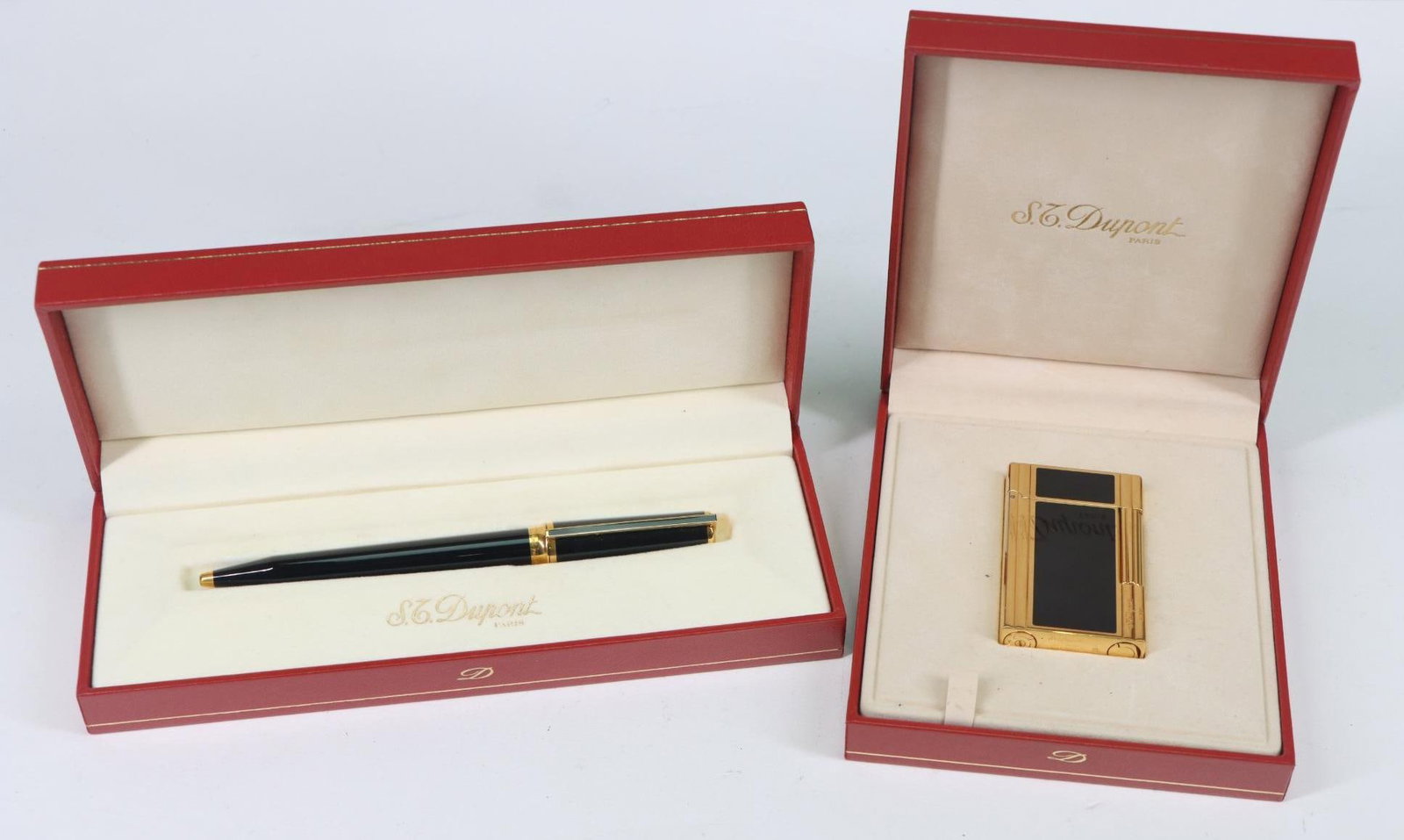 S.T. Dupont Black Lacquer Lighter and Pen Set: S.T. Dupont black lacquer and gold finish lighter and matching rollerball pen with original boxes.