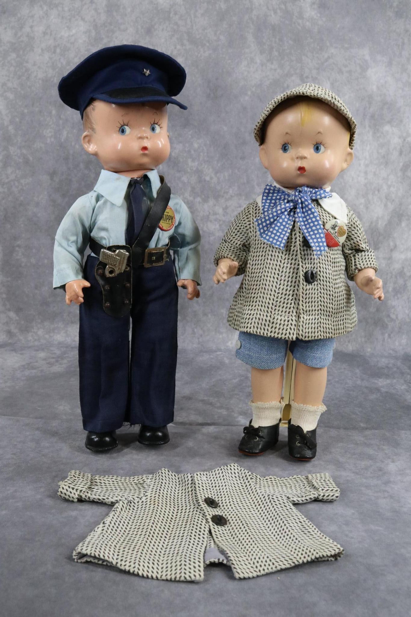 COMPOSITION - EFFANBEE.: PAIR of "Skippy" dolls. Both dolls have molded, painted hair, blue side glance eyes. Doll 1) is 14" and has brown hair. Composition head, arms and lower legs. Cloth torso. He has the molded black shoe