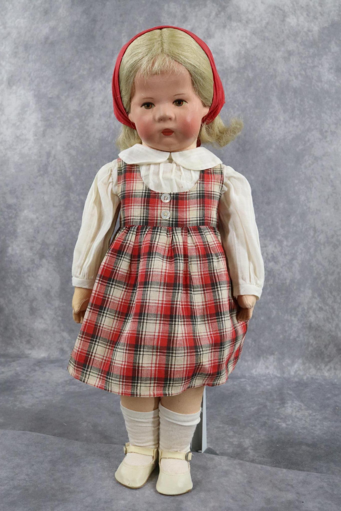 KATHE KRUSE.: 18" KATHE KRUSE doll IH 1930 on. Blonde human hair wig. Jointed body with wider swivel hips. Dress, blouse and scarf MAY be original. Replaced underpants. Original oilcloth shoes, socks. Left sole is 