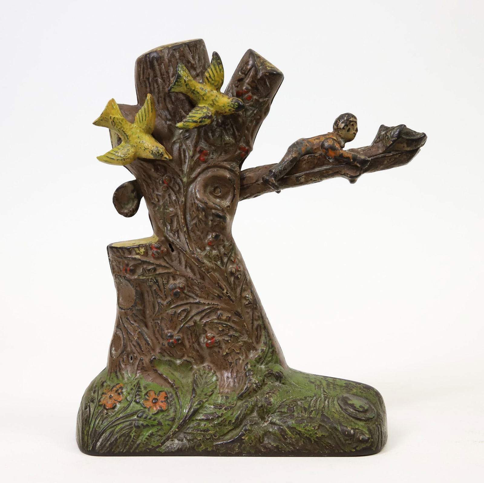 J.& E. Stevens "Boy Robbing Birds Nest" Mechanical Bank: J. & E. Stevens "Boy Robbing Birds Nest” cast iron mechanical bank, over painting, one cast iron bird is slightly loose, in working order, 8"h x 6"w base.