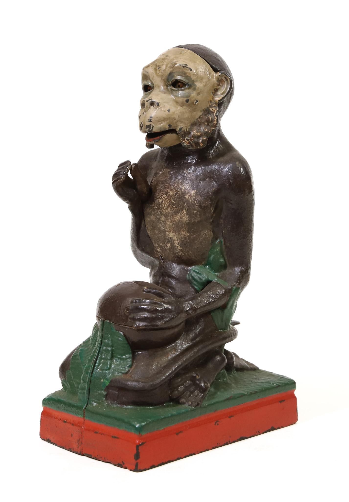 J. & E. Stevens "Monkey and Coconut" Mechanical Bank: J. & E. Stevens "Monkey and Coconut" cast iron mechanical bank, some repainting, in working order, 8.25"h x 5"w base".