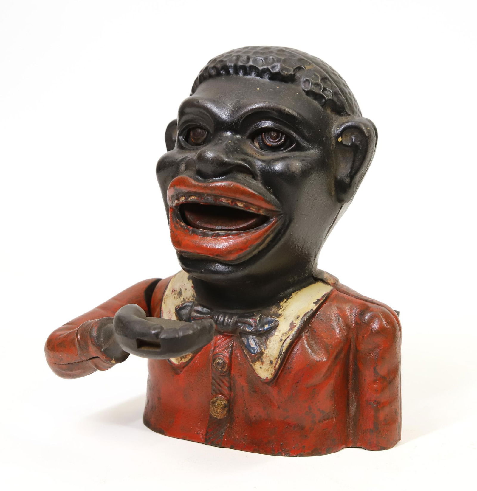 John Harper "Jolly N" Mechanical Bank: John Harper "Jolly N" cast iron mechanical bank, combination of original paint and over paint, fine cast details, replacement screw, in working order, 6.75"h 4.5"w base.