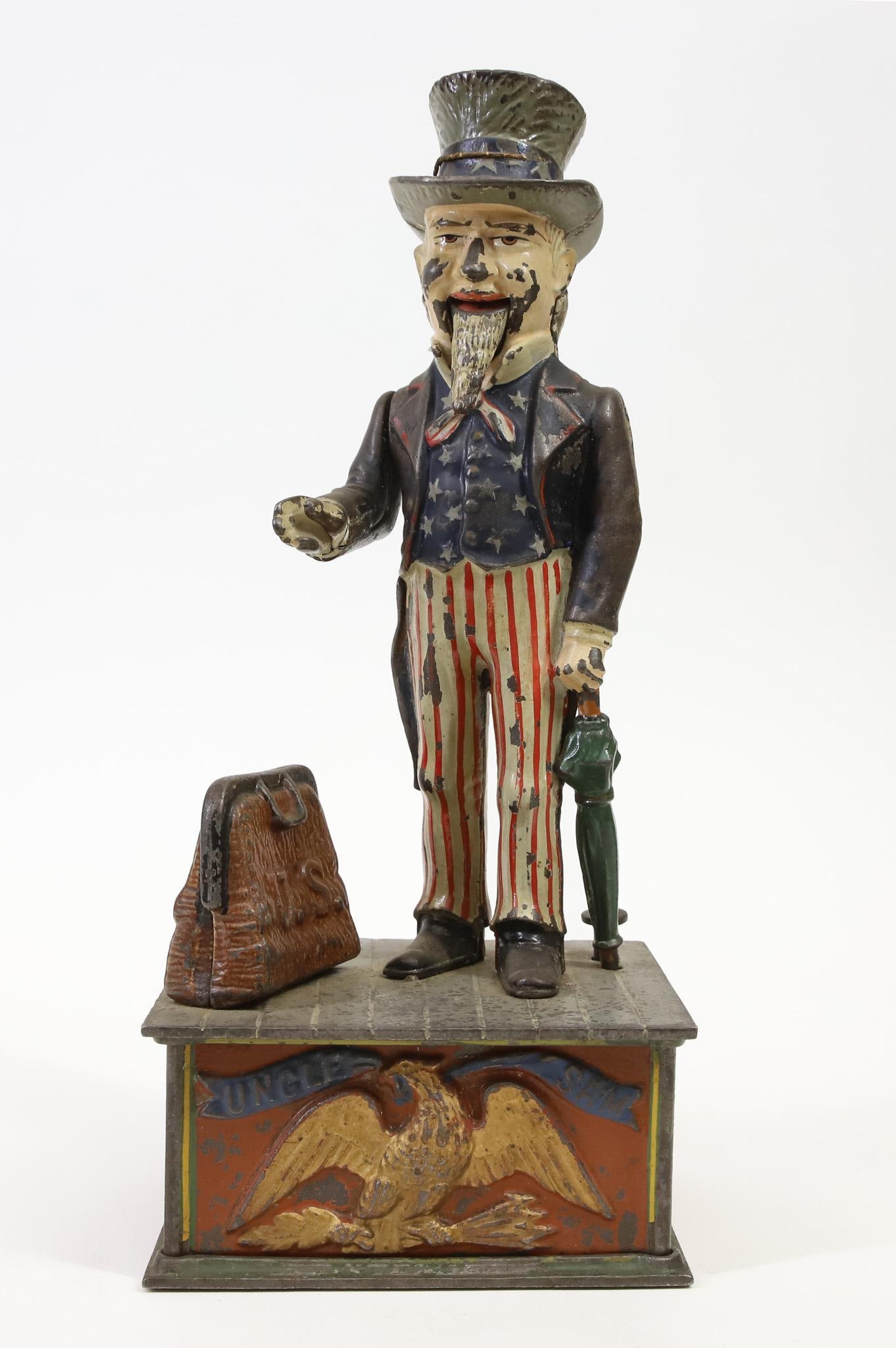 Shepard Hardware "Uncle Sam" Mechanical Bank: Shepard Hardware "Uncle Sam" cast iron mechanical bank, retains much of original paint, in working order, 11.5"h x 5"w base.