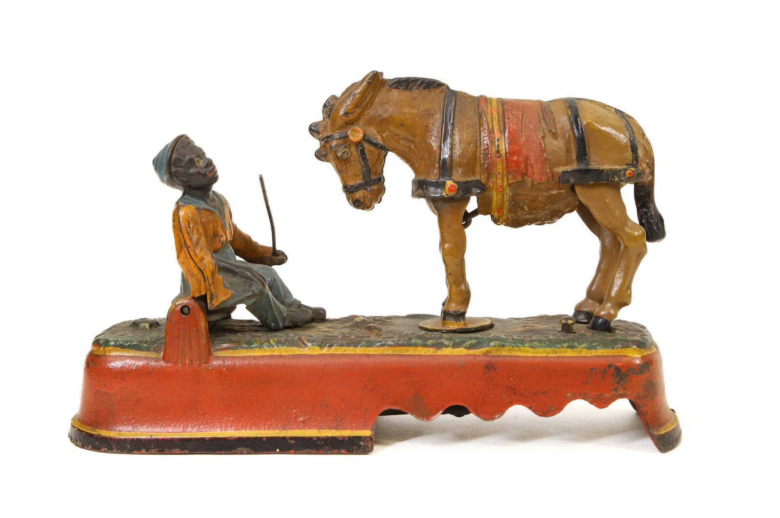 J. & E. Stevens "Spise a Mule" Mechanical Bank: J. & E. Stevens "Always Did 'Spise a Mule" cast iron mechanical bank, Black Americana, combination of original paint and over paint, in working order, 6"h x 10"w base.
