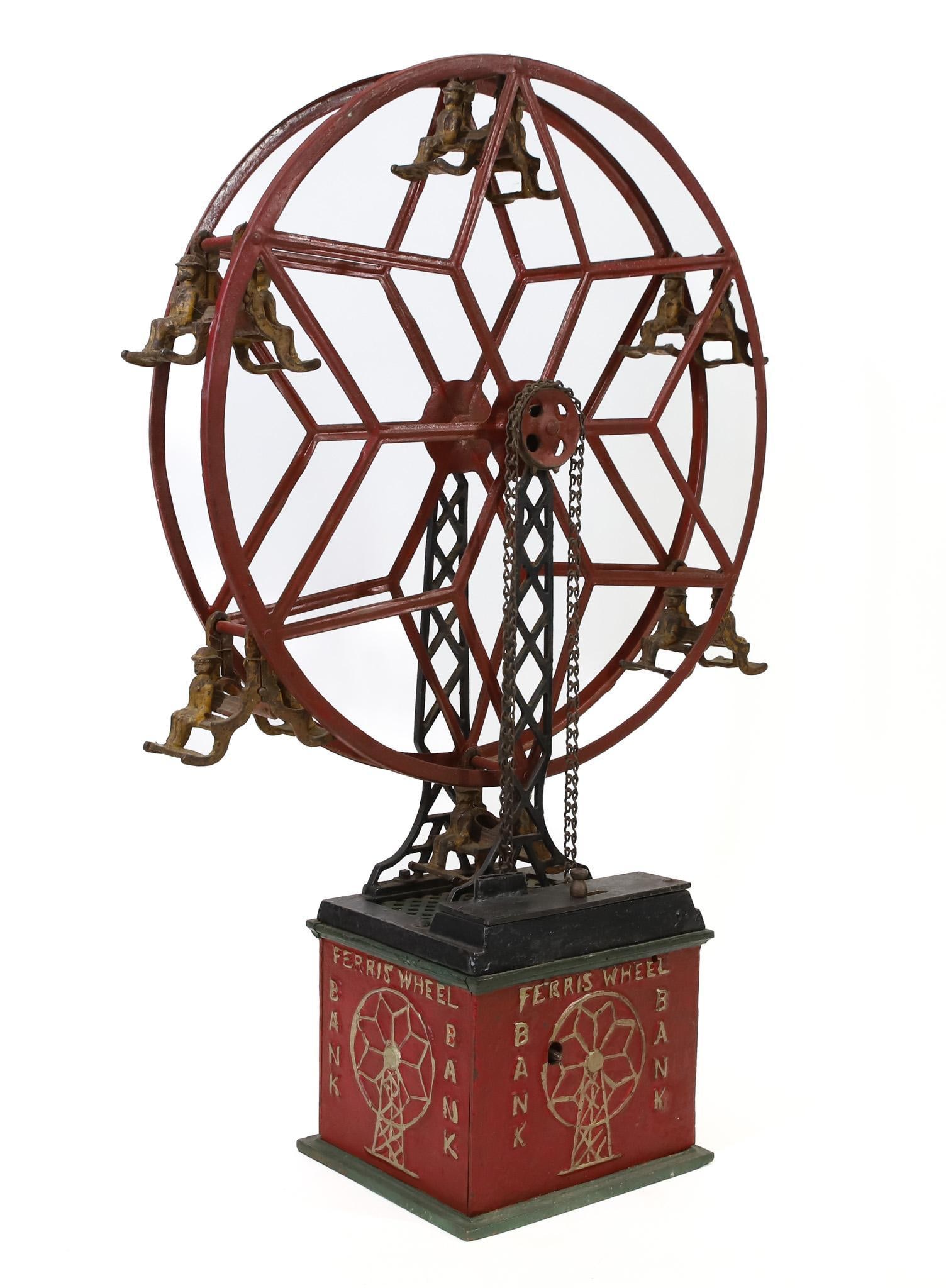 Hubley "Ferris Wheel" Mechanical Bank: Hubley "Ferris Wheel" cast iron and pressed steel wind-up mechanical bank, c. 1930, over paint on base and wheel, original paint (worn) on seated guests, in working order, includes a wide-up key, key