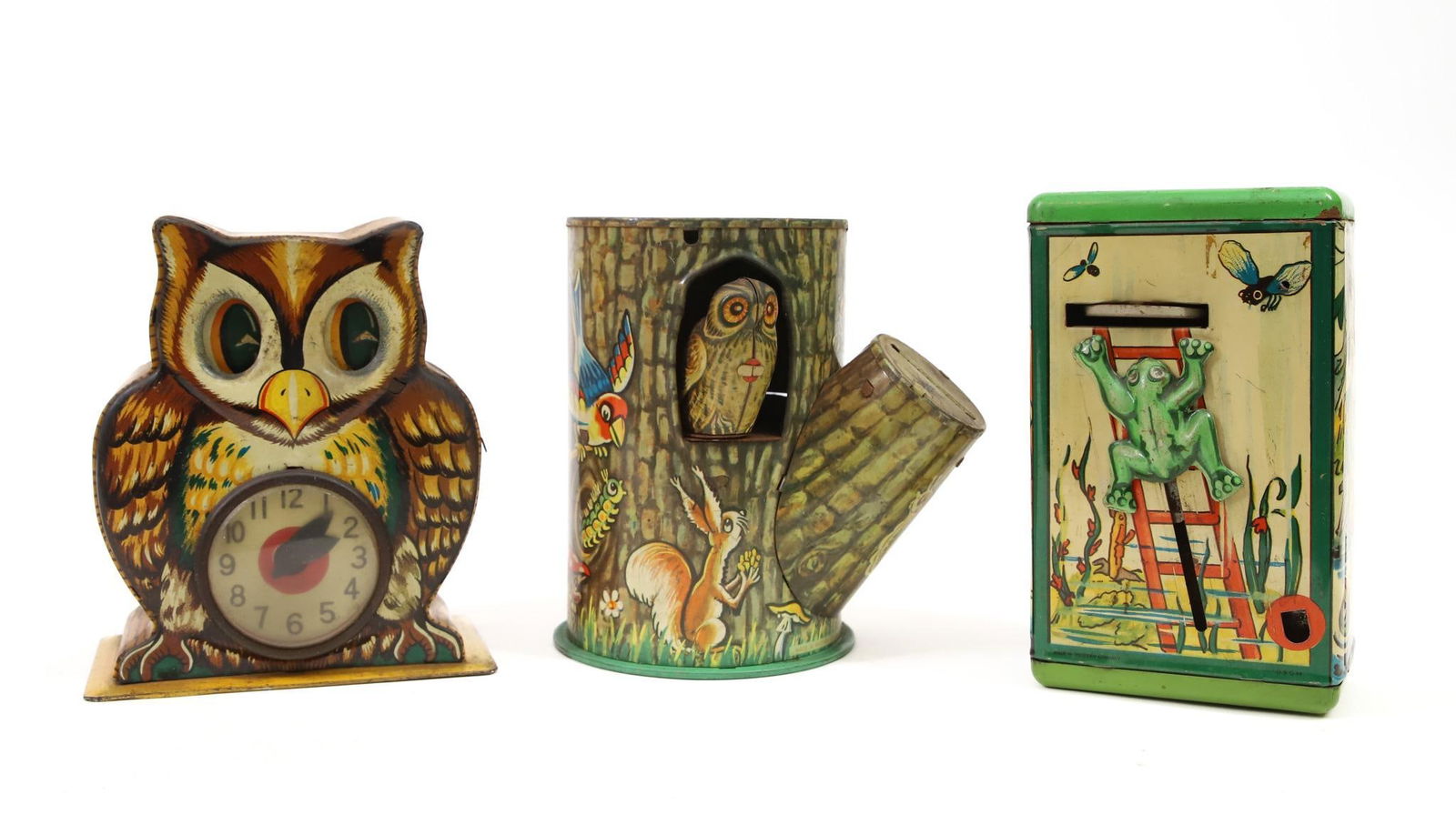 Tin Lithograph Mechanical Banks: Plaything "My Best Friend" tin lithograph owl mechanical bank, push coin in eyes move and clock arms spin, good graphics with slight wear, in working condition, 5"h x 4"w base. German "Frog at Play" t
