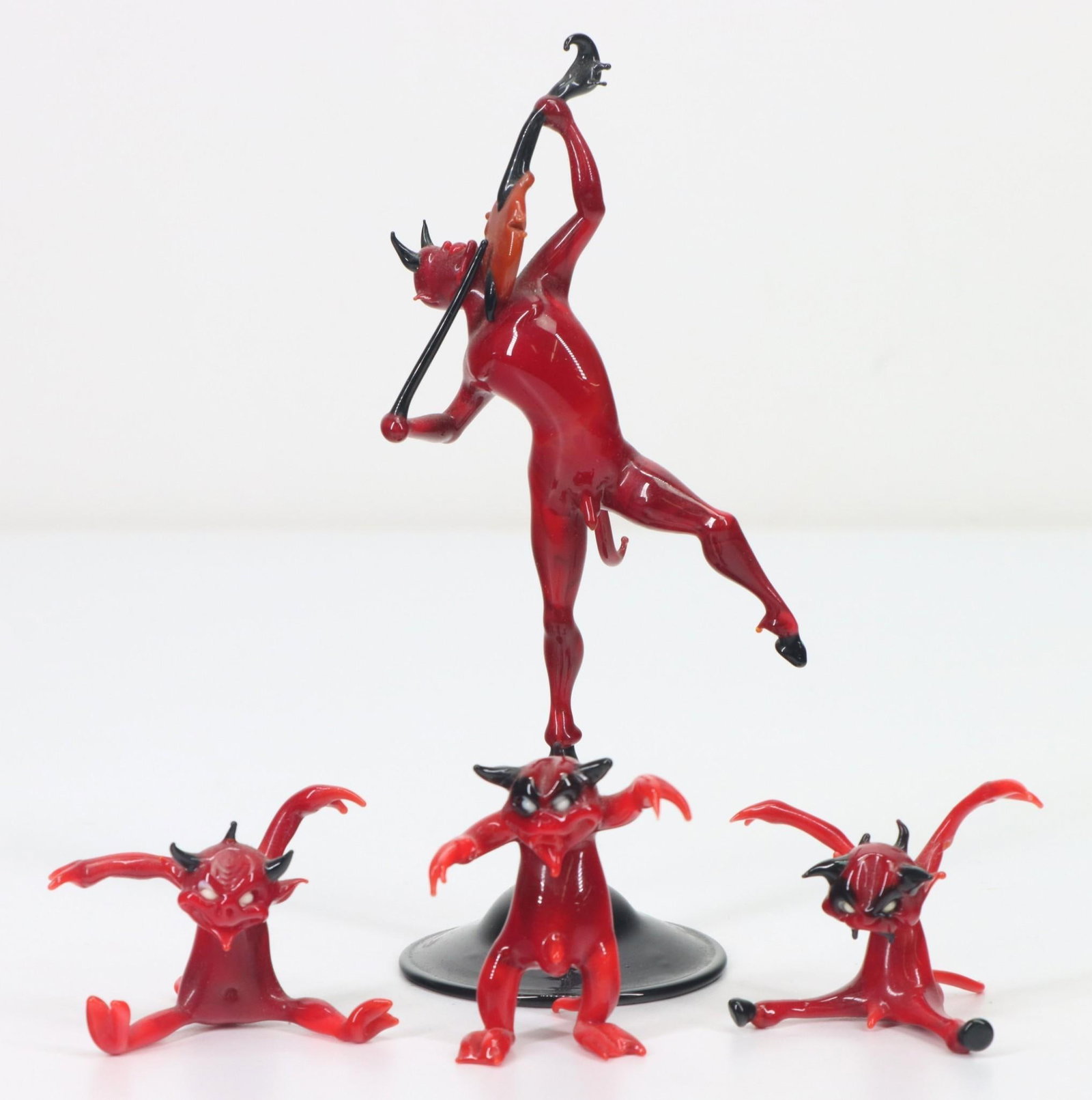 Art Glass Sculptures in the manner of Lucio Bubacco: Lampworked art glass sculptures of a devil playing the violin and additional complementing figures. Unsigned. 1.5"h to 5.5"h