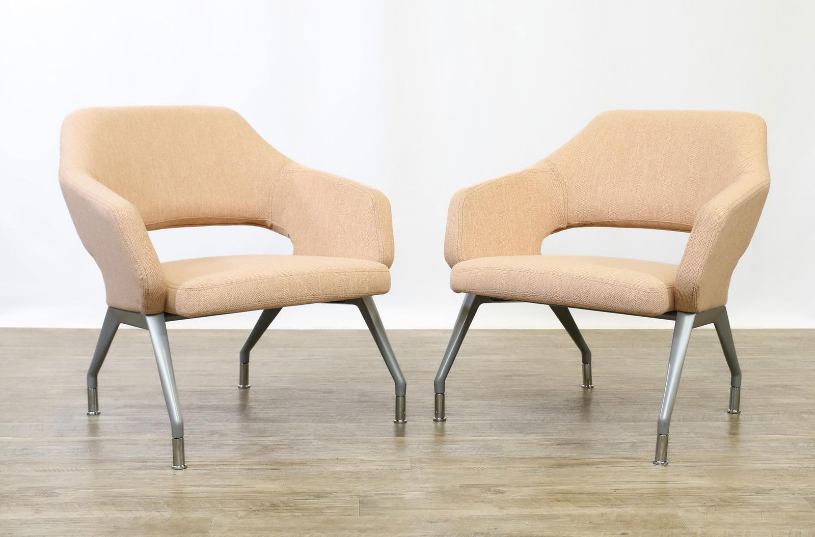 David Ritch and Mark Saffell for Arcadia + Encore "Flirt" Nesting Lounge Chairs: Contemporary nesting pair of lounge chairs, model no. 6920 with mid backs, flip up seats, four-leg "90 metallic silver" aluminum bases, and "Mode / Blush 021" upholstery by Maharam. 30"h x 30.5"w x 28