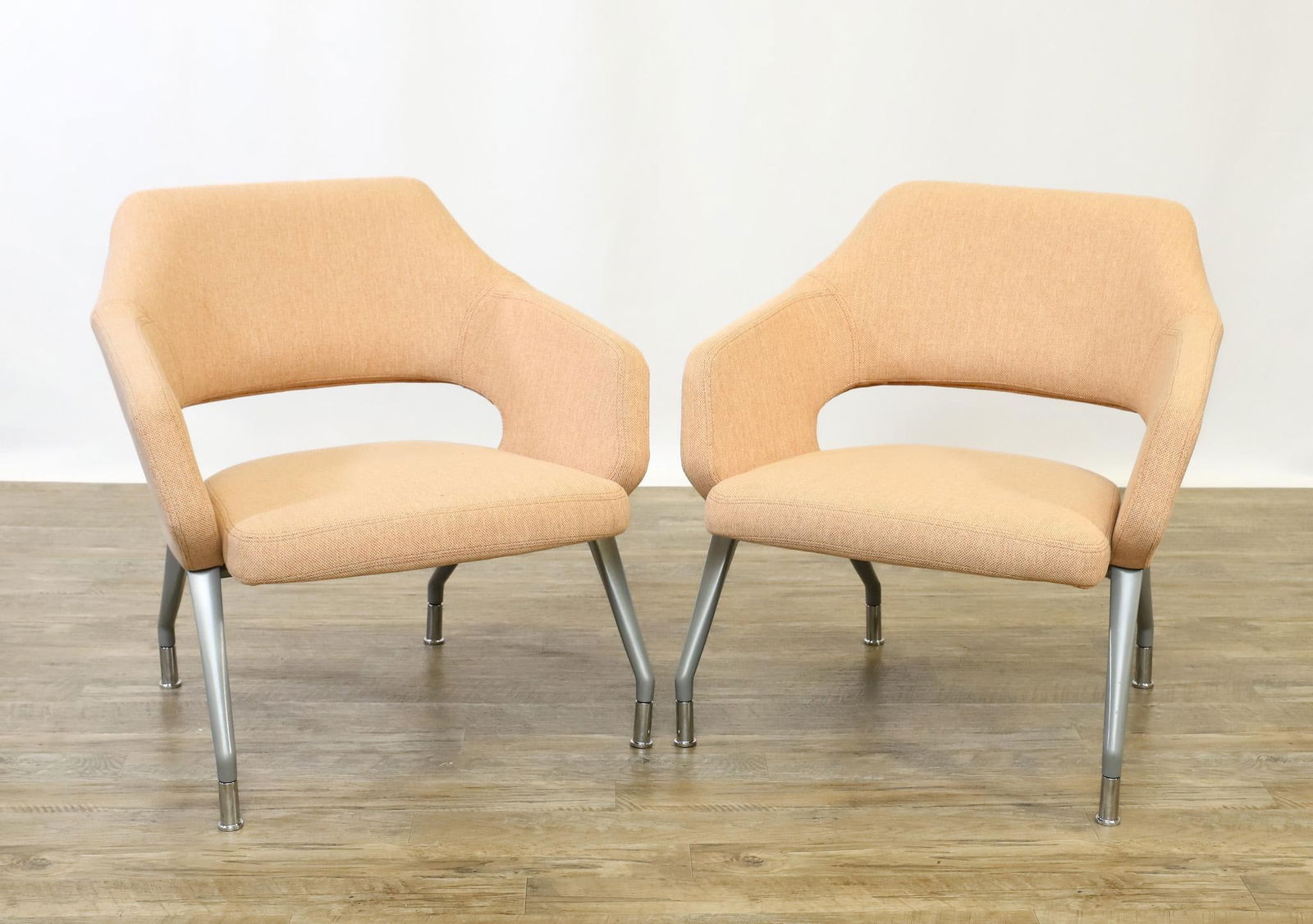 David Ritch and Mark Saffell for Arcadia + Encore "Flirt" Nesting Lounge Chairs: Contemporary nesting pair of lounge chairs, model no. 6920 with mid backs, flip up seats, four-leg "90 metallic silver" aluminum bases, and "Mode / Blush 021" upholstery by Maharam. 30"h x 30.5"w x 28