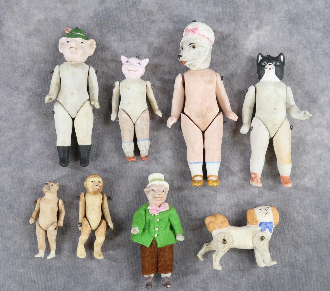 ALL BISQUE.: LOT of (7) dolls with animal heads and a dog. 2 1/2" - 5". (2) Pigs. (3) Cats. (2) Dogs. Monkey. Some are marked 5360 4/0. 4297/3. 5701/1. Spaniel. Condition: bisque is rough. This lot is being sold A
