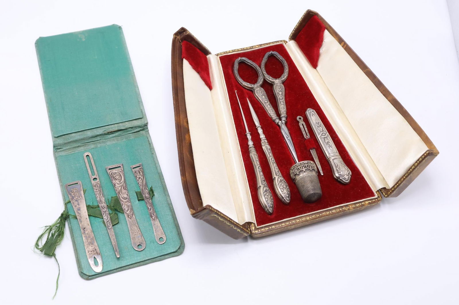 Sewing Etuis: Velvet and silk lined and fitted etui with tools including needle case, sewing awl, crochet hook, bodkin, scissor and thimble (missing latch pieces at closure) Sterling bodkin set in folding satin cas