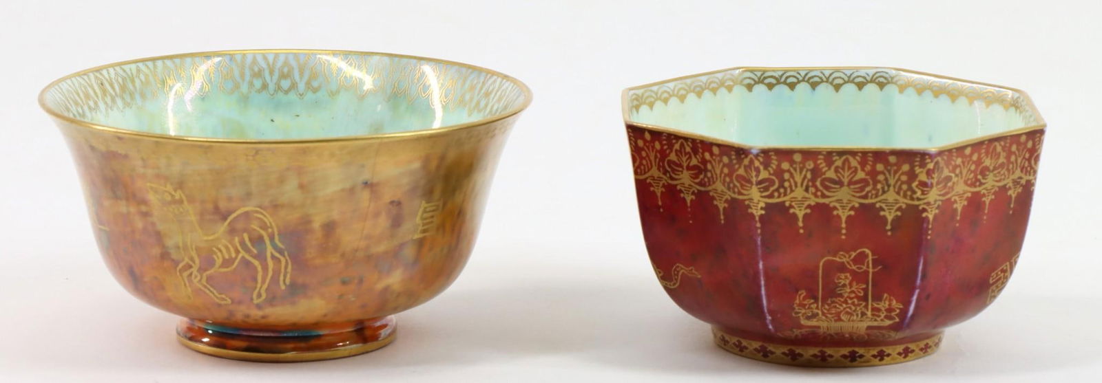 Wedgwood Fairyland Luster Cups: Iridescent lusterware porcelain cups designed by Daisy Makeig-Jones for Wedgwood, including an octagonal piece with gilt phoenix and other orientalist motifs and borders on a red exterior and celadon