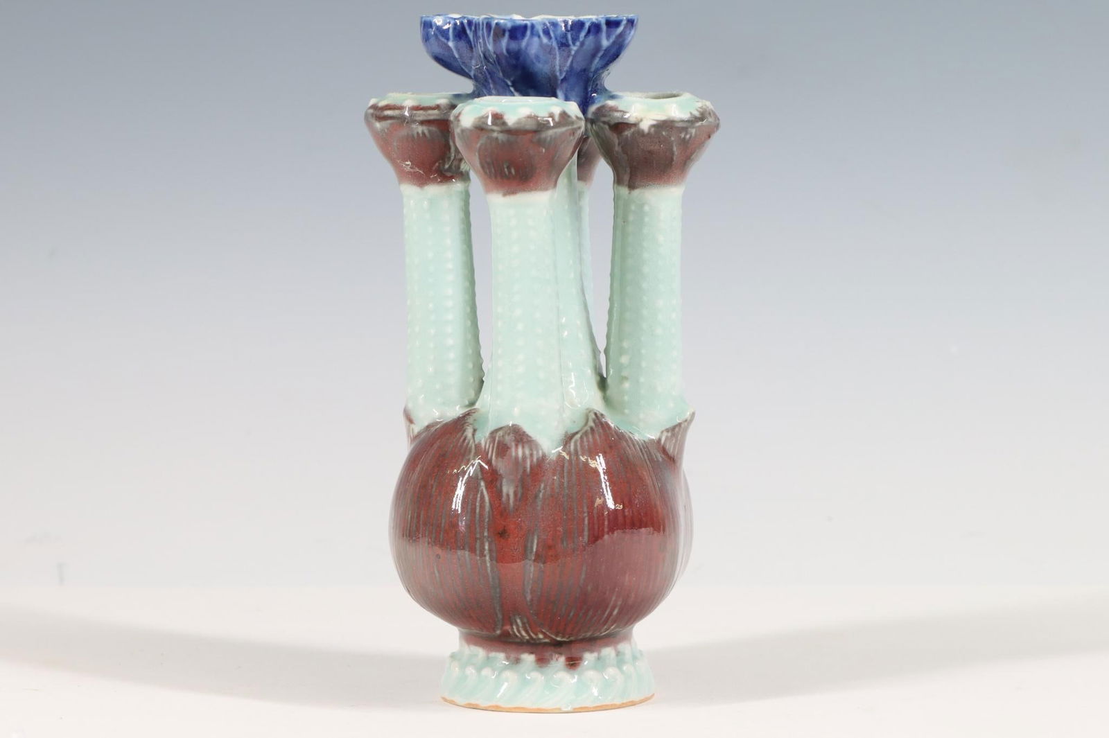 Chinese Porcelain Crocus Pot: Red flambe, celadon, and cobalt blue crocus pot with Kangxi mark. 6.25"h x 3"w